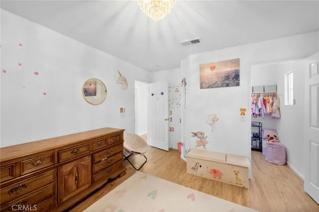 a large bathroom with a tub sink and mirror