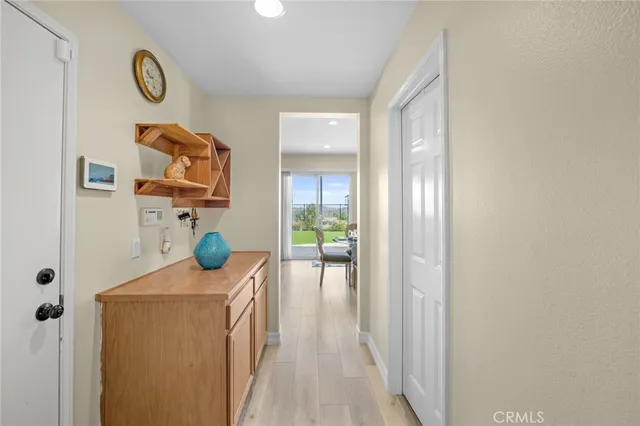 a view of hallway with livingroom and furniture