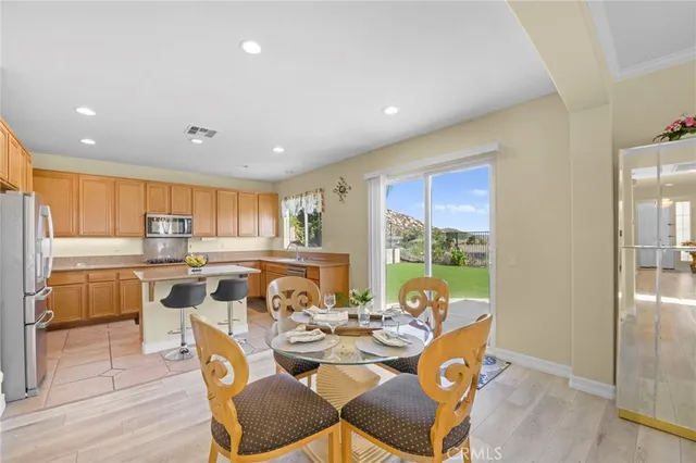 a view of a dining room with furniture window and outside view