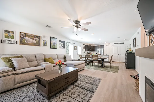 a living room with furniture and white walls