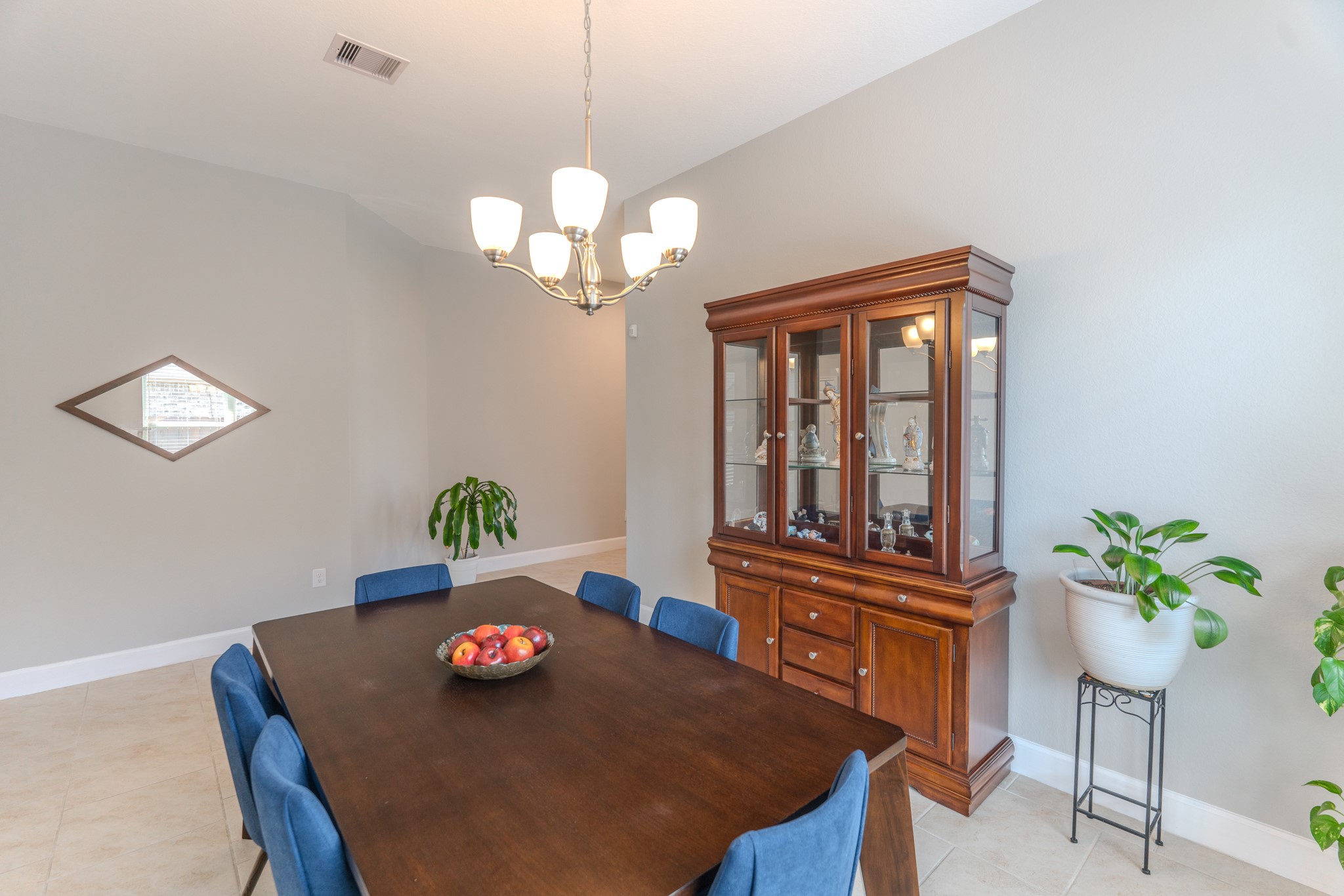 24322 North Newcastle Bay Trail Spring, TX 77389 - Photo 13 of 50 a view of a dining room with furniture a chandelier and wooden floor