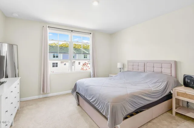 a bedroom with a bed and window