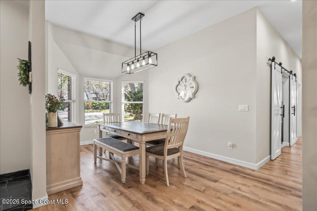 35 River Ridge Drive Rockledge, FL 32955 - Photo 16 of 48 a view of a dining room with furniture window and wooden floor