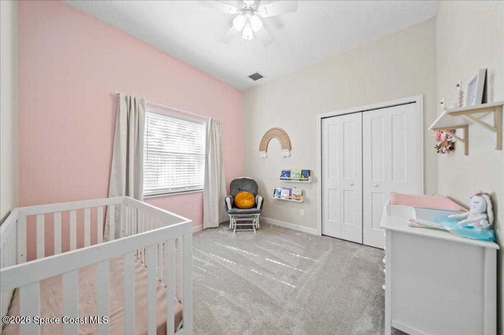 35 River Ridge Drive Rockledge, FL 32955 - Photo 22 of 48 a living room with furniture and a window