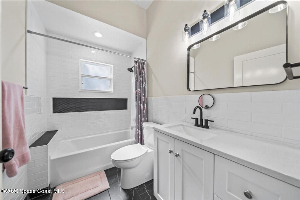 35 River Ridge Drive Rockledge, FL 32955 - Photo 23 of 48 a bathroom with a sink a toilet and bathtub