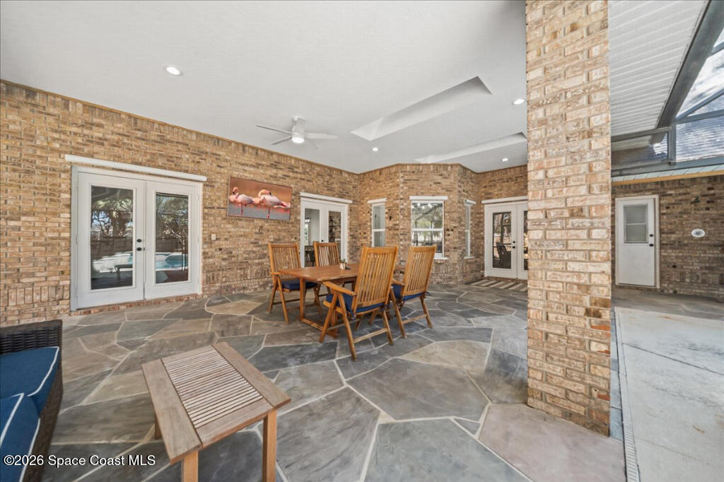 35 River Ridge Drive Rockledge, FL 32955 - Photo 27 of 48 a view of a dinning room with a table and chairs