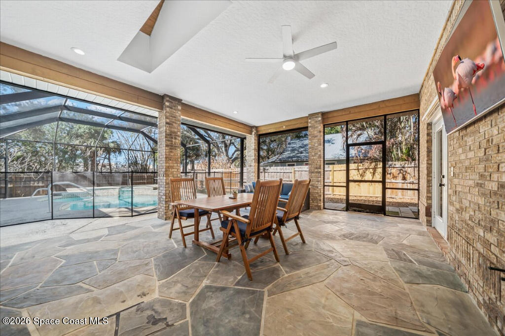 35 River Ridge Drive Rockledge, FL 32955 - Photo 28 of 48 a dining room with furniture and large windows
