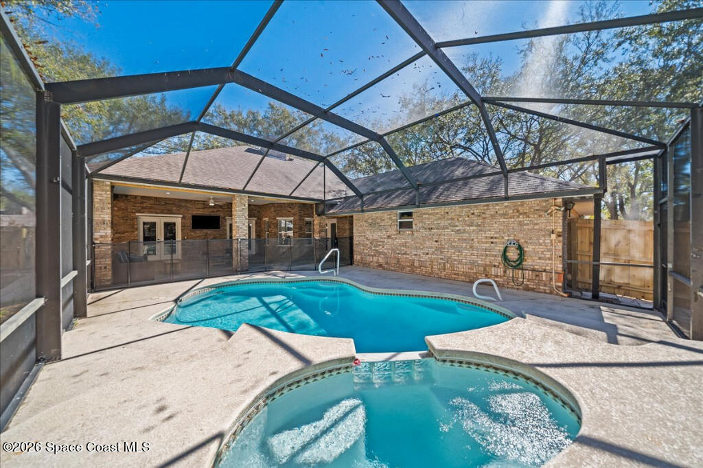 35 River Ridge Drive Rockledge, FL 32955 - Photo 32 of 48 a patio with a table and chairs
