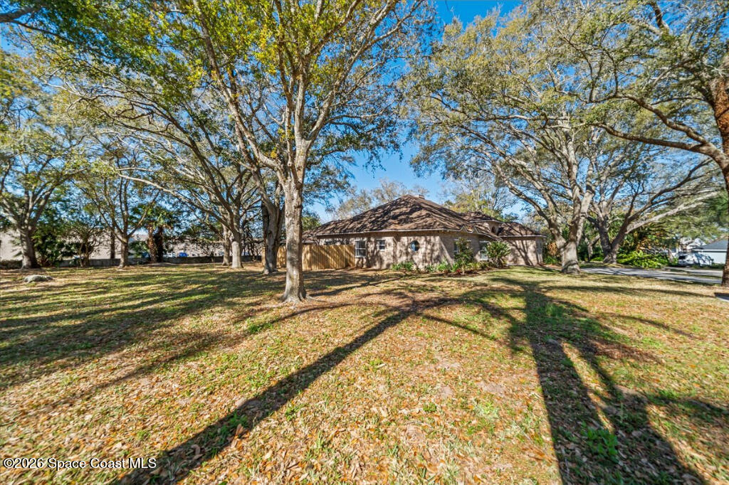 35 River Ridge Drive Rockledge, FL 32955 - Photo 36 of 48 a view of a yard with swimming pool