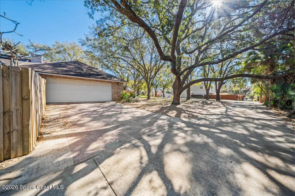 35 River Ridge Drive Rockledge, FL 32955 - Photo 39 of 48 a view of empty room with tree and wooden fence