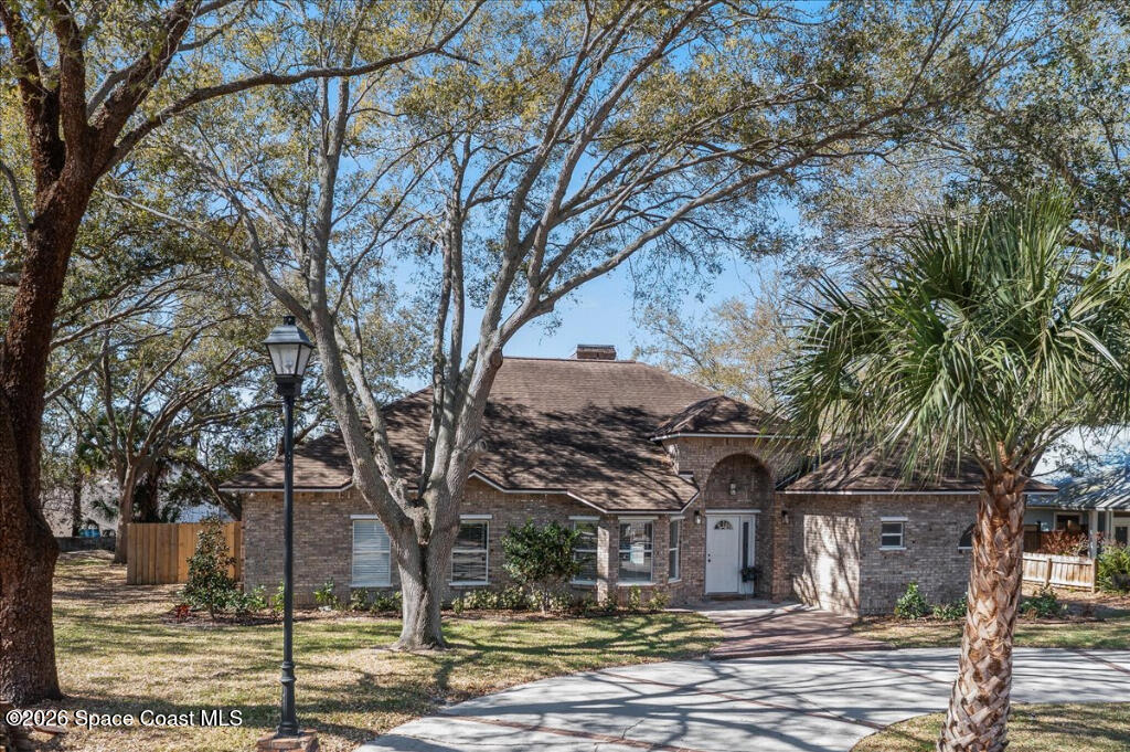 35 River Ridge Drive Rockledge, FL 32955 - Photo 40 of 48 a view of a town with large trees