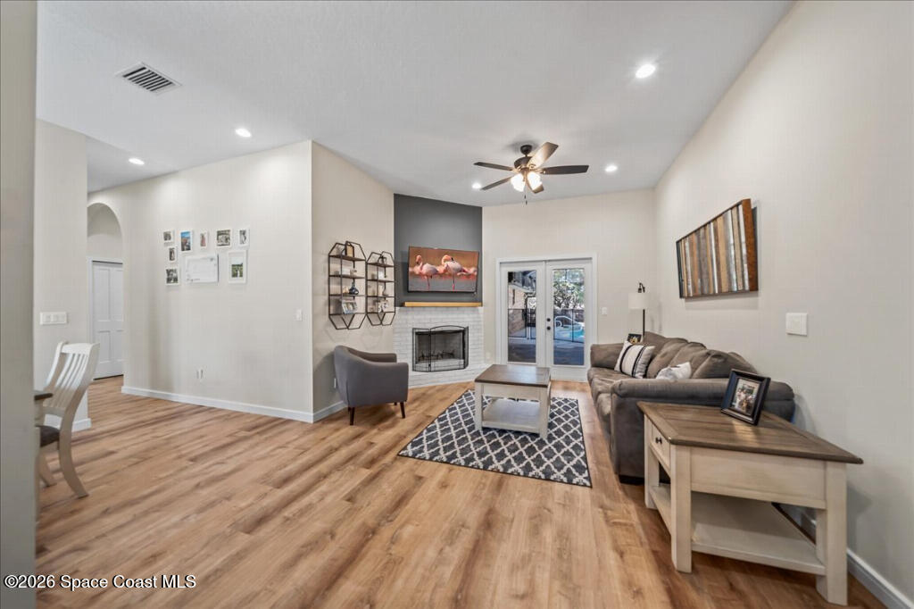 35 River Ridge Drive Rockledge, FL 32955 - Photo 4 of 48 a living room with furniture and a flat screen tv
