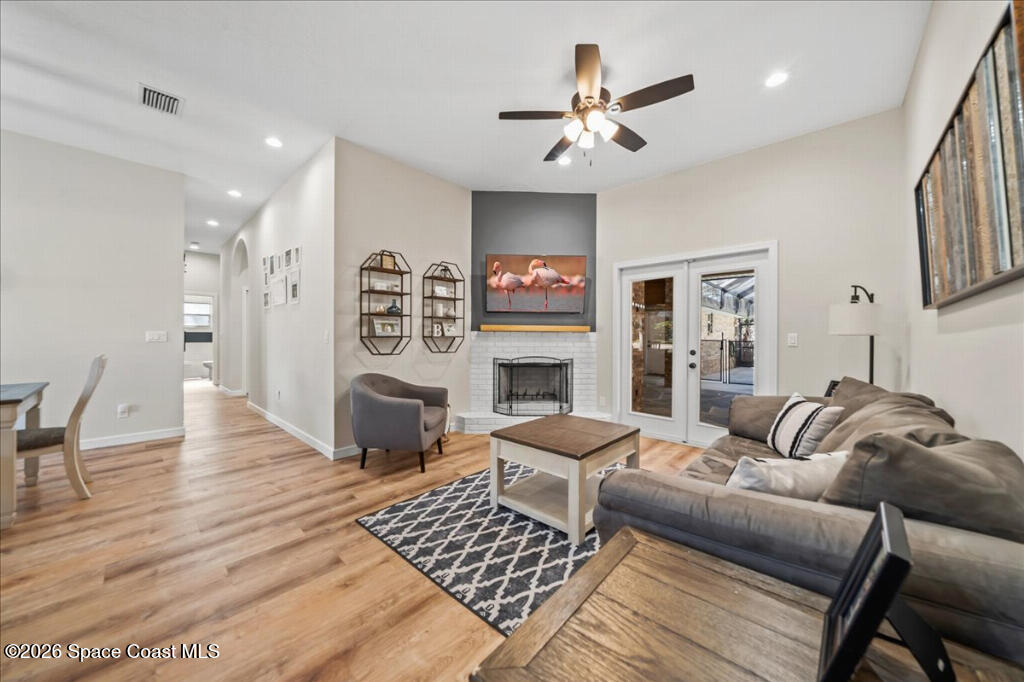 35 River Ridge Drive Rockledge, FL 32955 - Photo 5 of 48 a living room with furniture a fireplace and a table