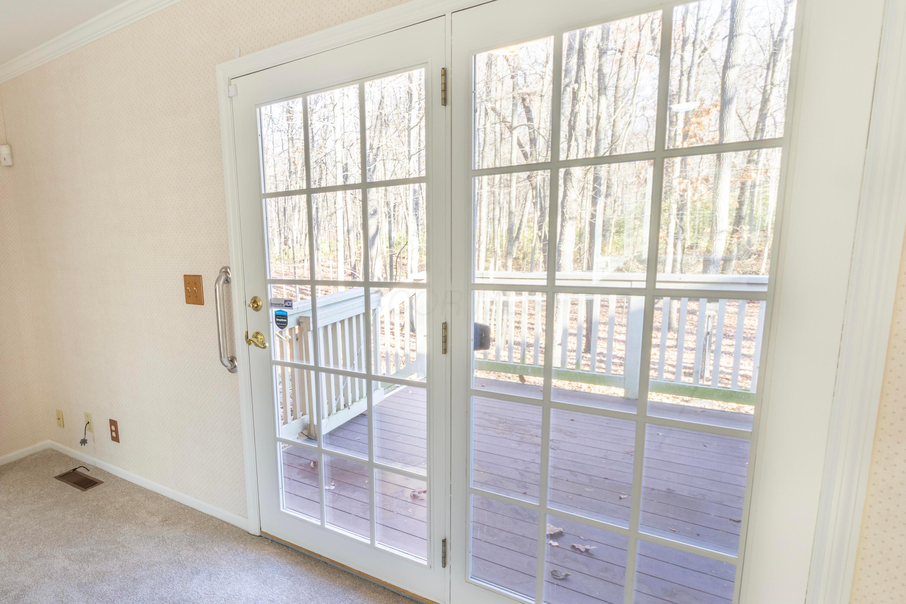 3880 Fry Road Ostrander, OH 43061 - Photo 53 of 82 Lovely french doors lead to the deck and backyard. Allows you to see the view and lets in the natural light.