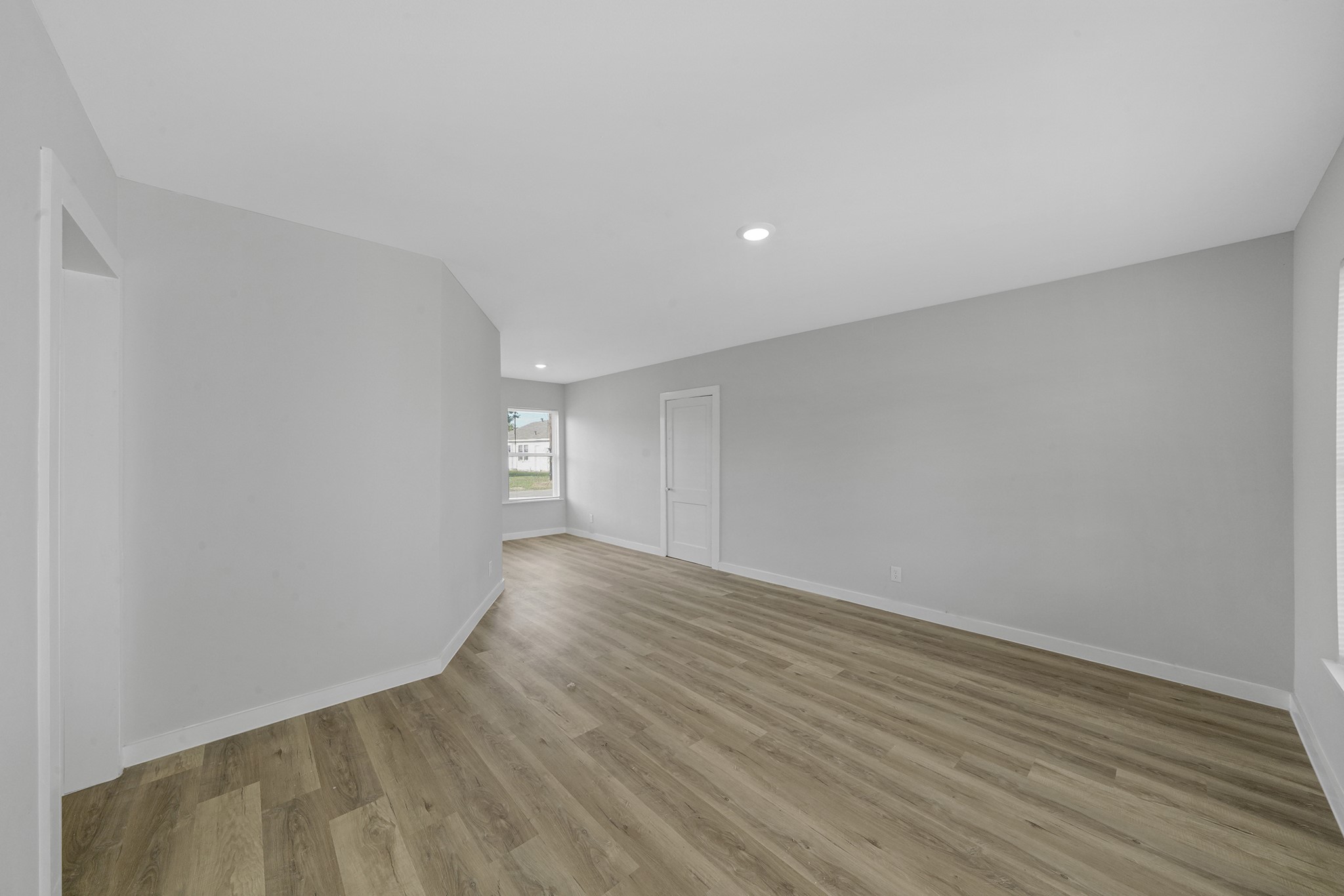 1753 West 6th Street Freeport, TX 77541 - Photo 16 of 20 a view of an empty room with wooden floor
