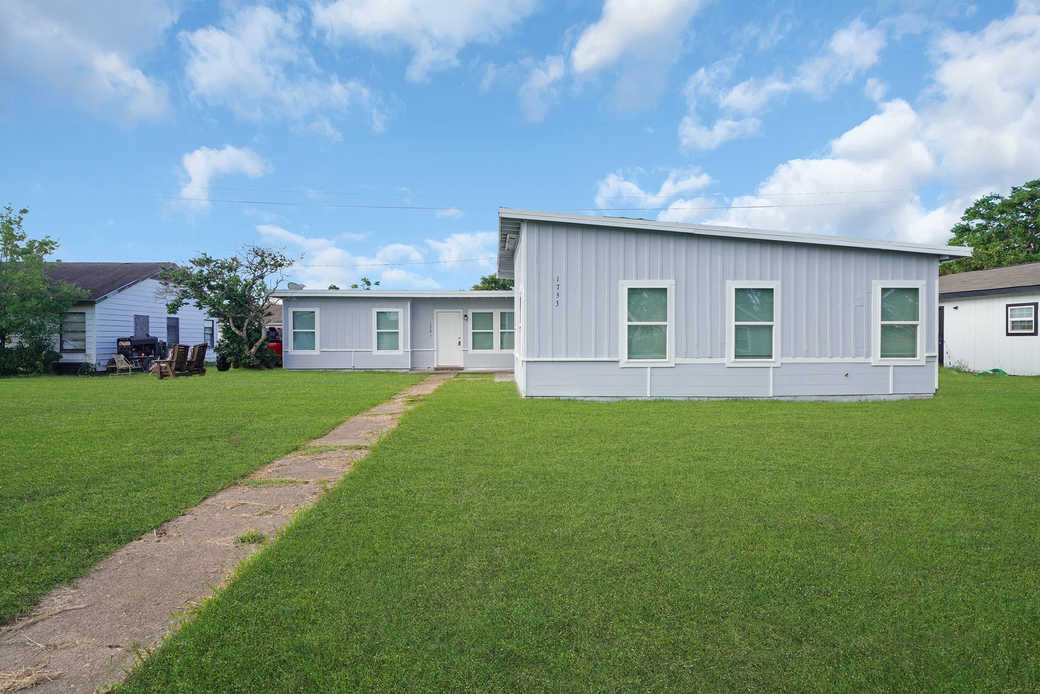 1753 West 6th Street Freeport, TX 77541 - Photo 2 of 20 a view of a house with a backyard