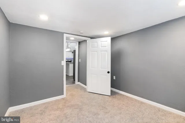 an empty room with an entryway door