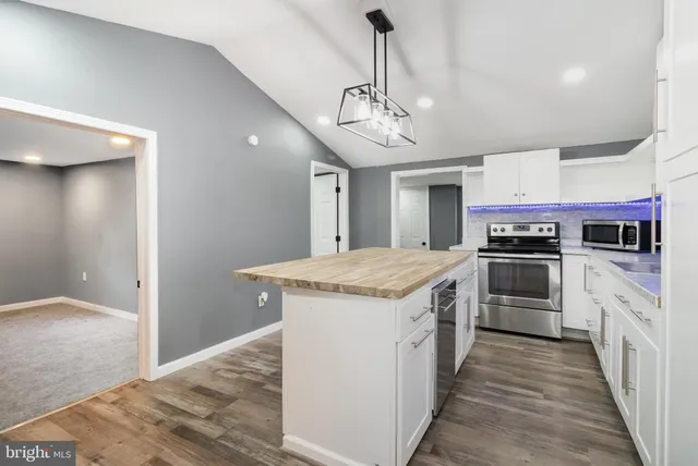a kitchen with a stove and a sink