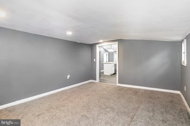 a view of an empty room and window