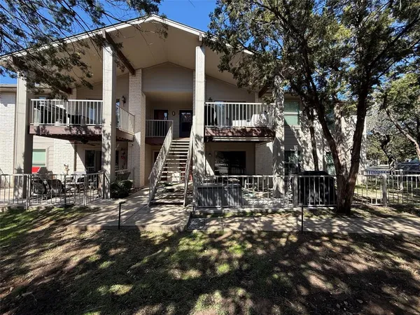 a view of house with trees in the background