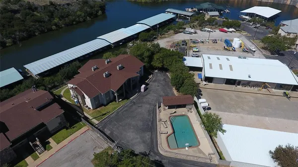 an aerial view of a house with a yard