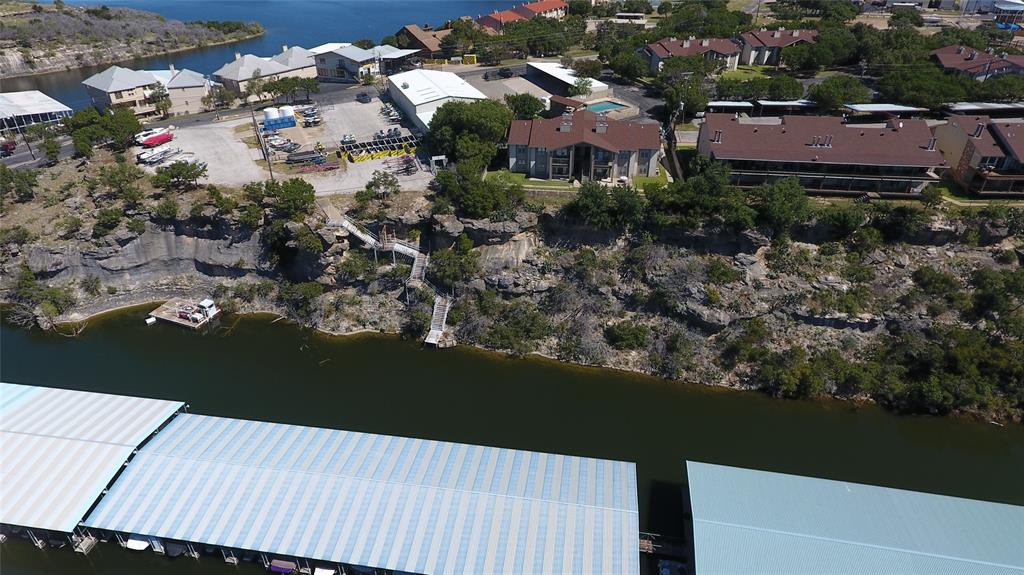 3059 Hells Gate Loop, Unit 8 Strawn, TX 76475 - Photo 17 of 20 an aerial view of residential house and outdoor space