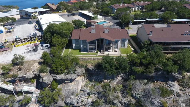 an aerial view of a houses with outdoor space and street view