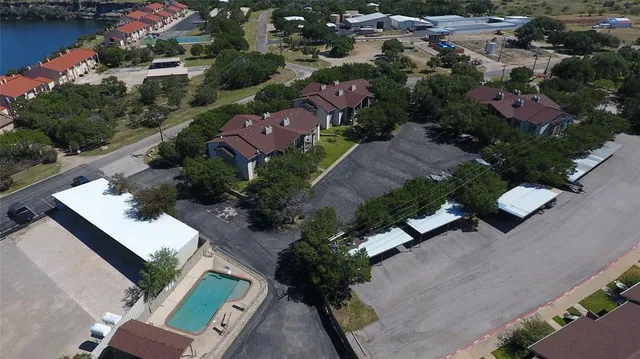 an aerial view of residential houses with outdoor space