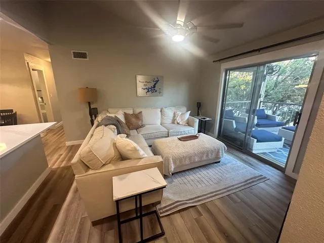 a bedroom with furniture and wooden floor