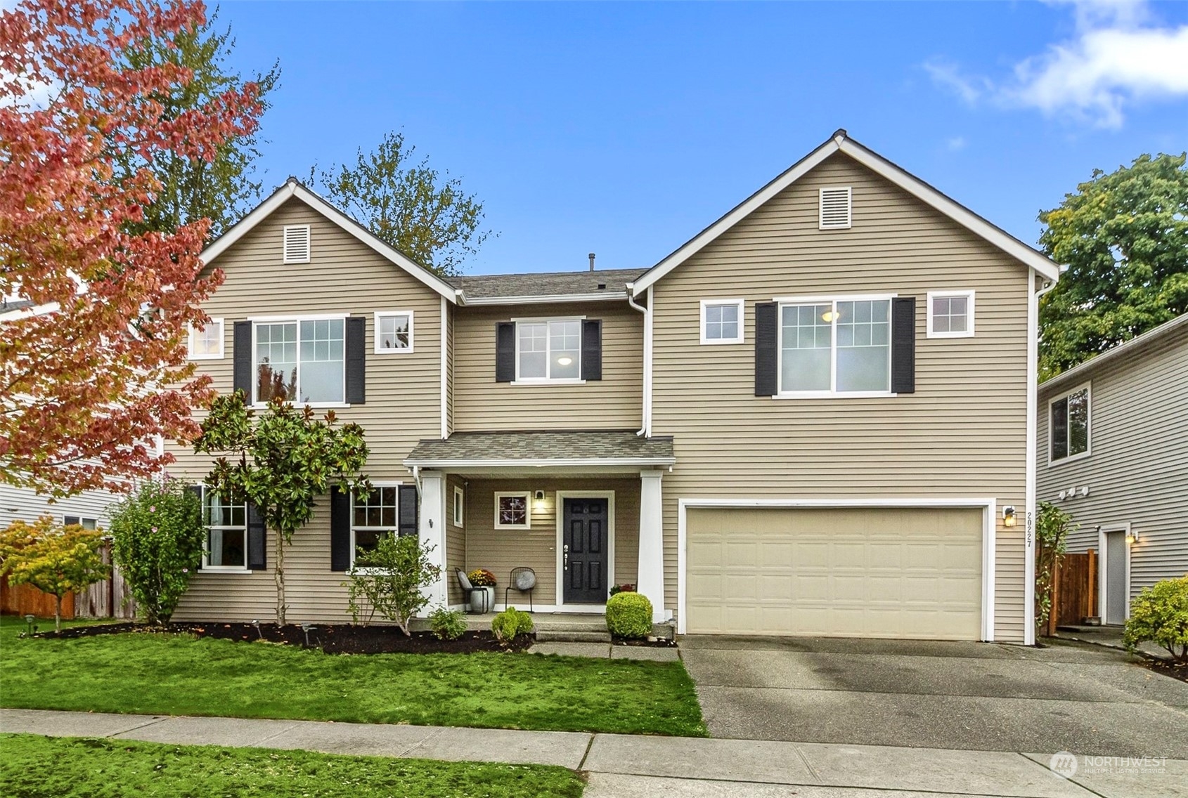 a front view of a house with garden