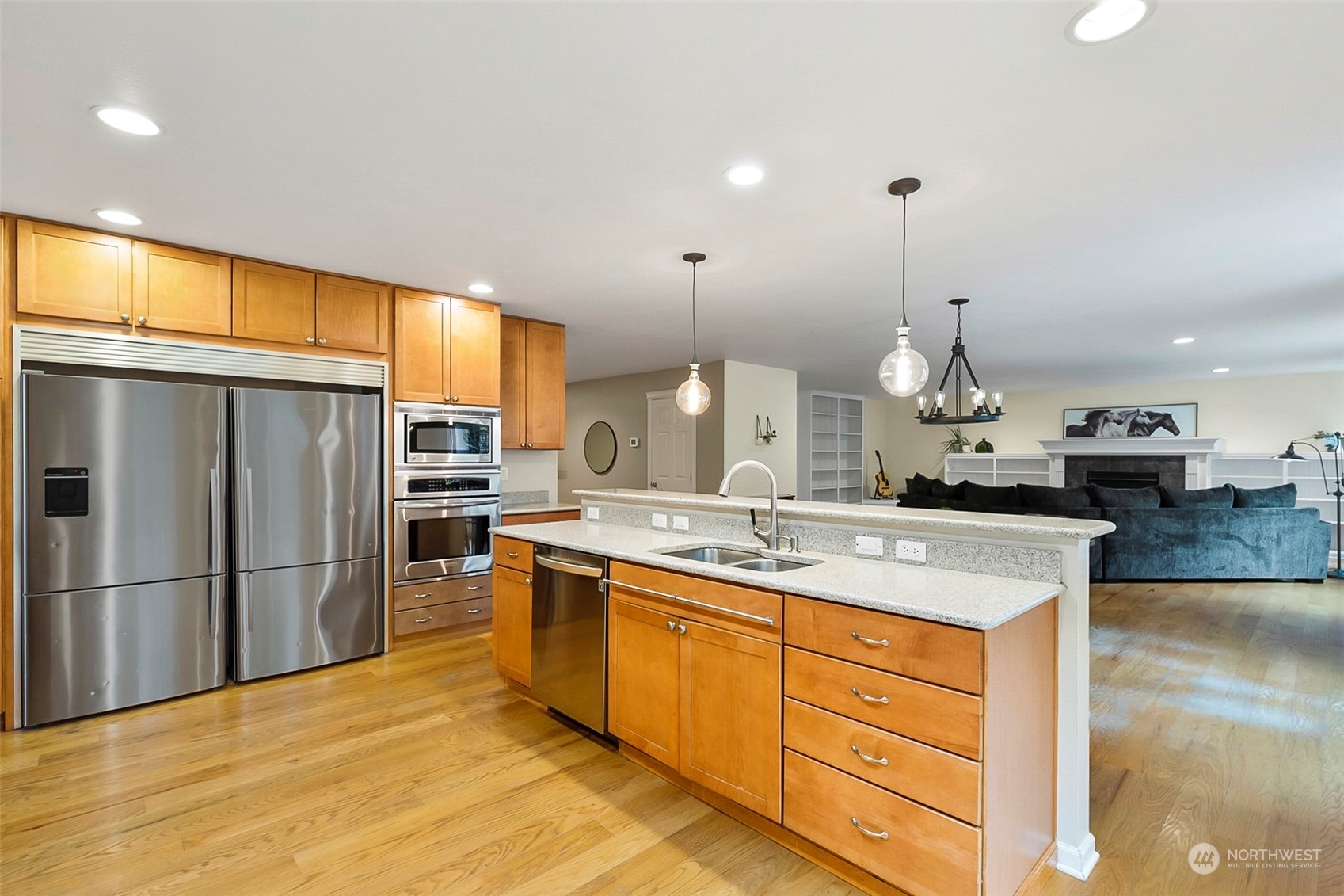 20227 Rustic View Road Southeast Monroe, WA 98272 - Photo 15 of 37 a kitchen with stainless steel appliances granite countertop a sink a stove and a refrigerator