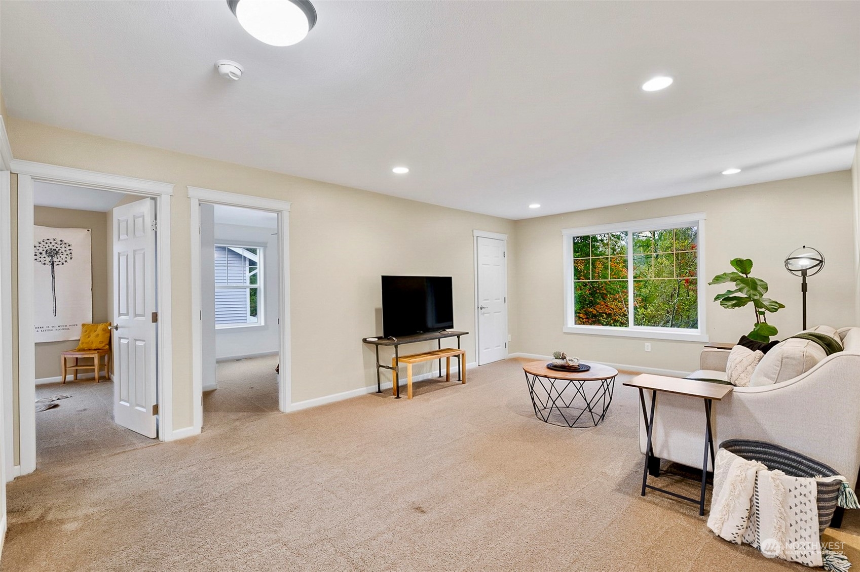 20227 Rustic View Road Southeast Monroe, WA 98272 - Photo 20 of 37 a living room with furniture and a flat screen tv