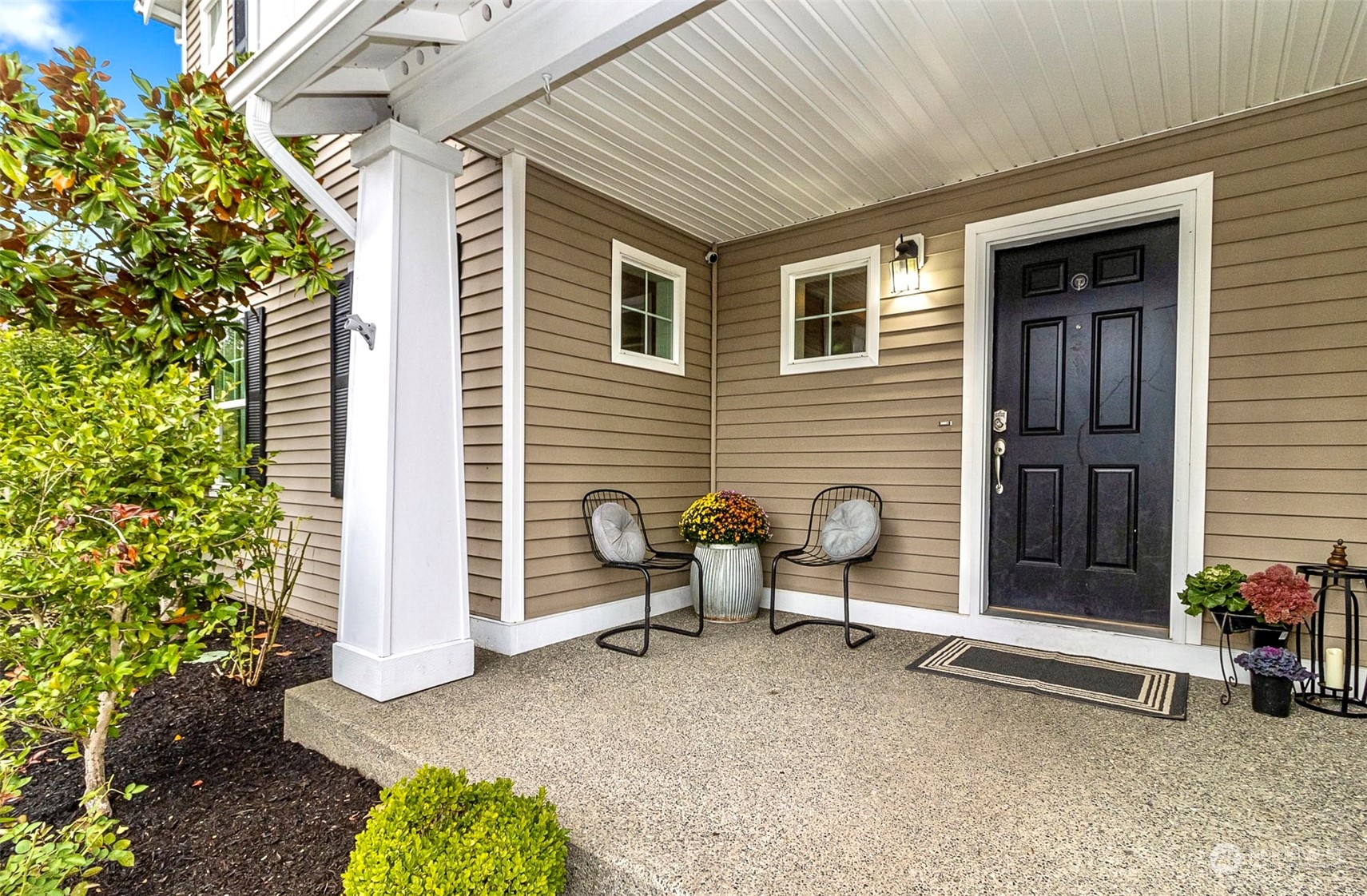 20227 Rustic View Road Southeast Monroe, WA 98272 - Photo 2 of 37 a backyard of a house with outdoor seating