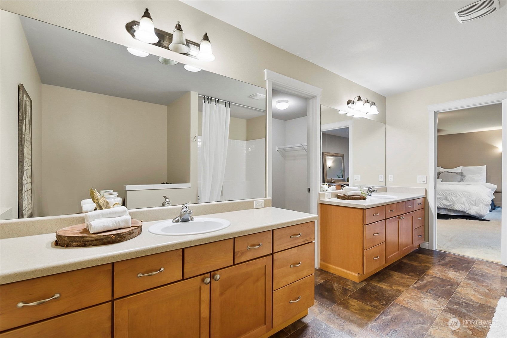 20227 Rustic View Road Southeast Monroe, WA 98272 - Photo 25 of 37 a spacious bathroom with a double vanity sink and a mirror