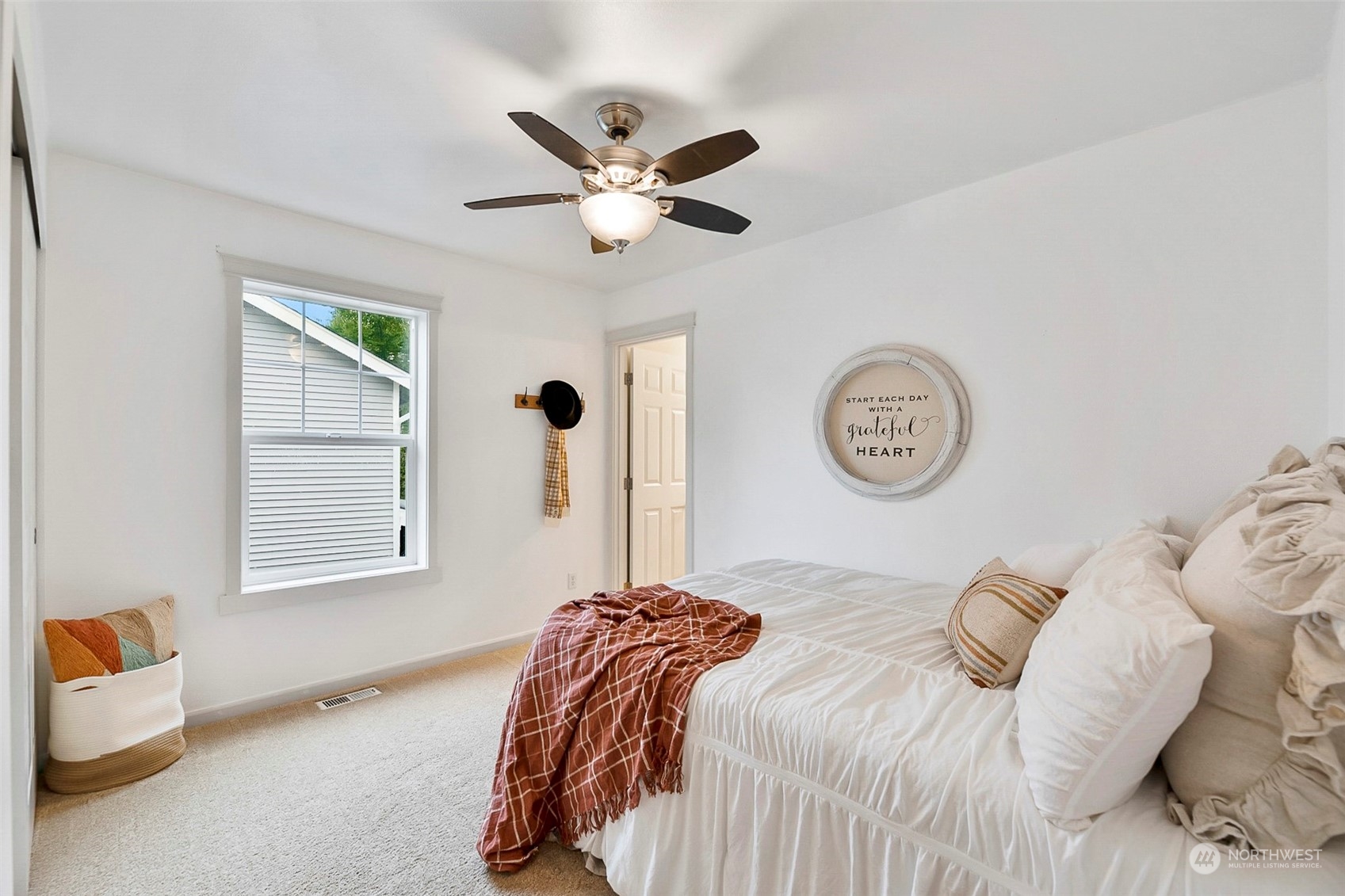 20227 Rustic View Road Southeast Monroe, WA 98272 - Photo 27 of 37 a bedroom with a bed and a window