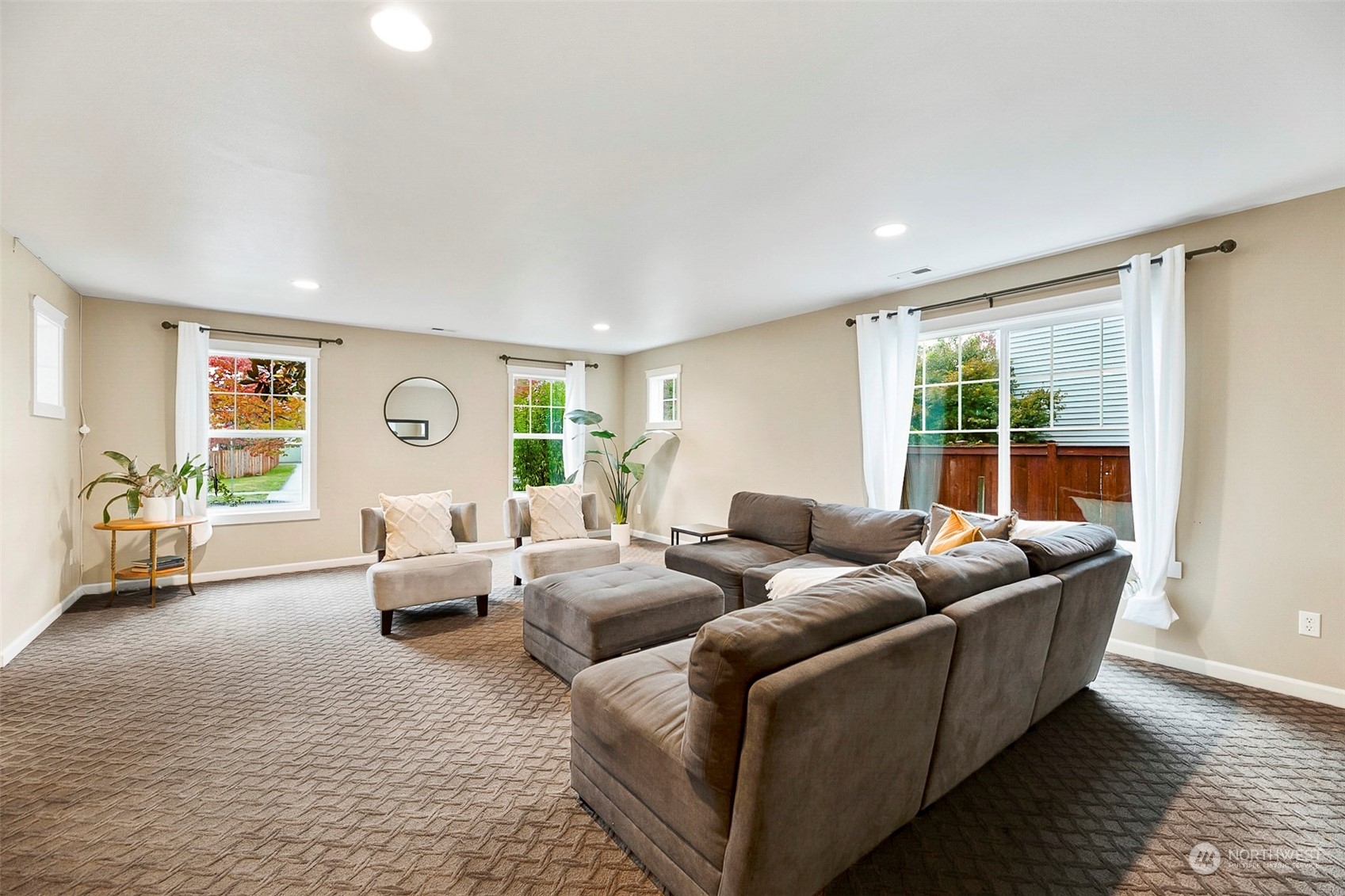 20227 Rustic View Road Southeast Monroe, WA 98272 - Photo 4 of 37 a living room with furniture and a large window