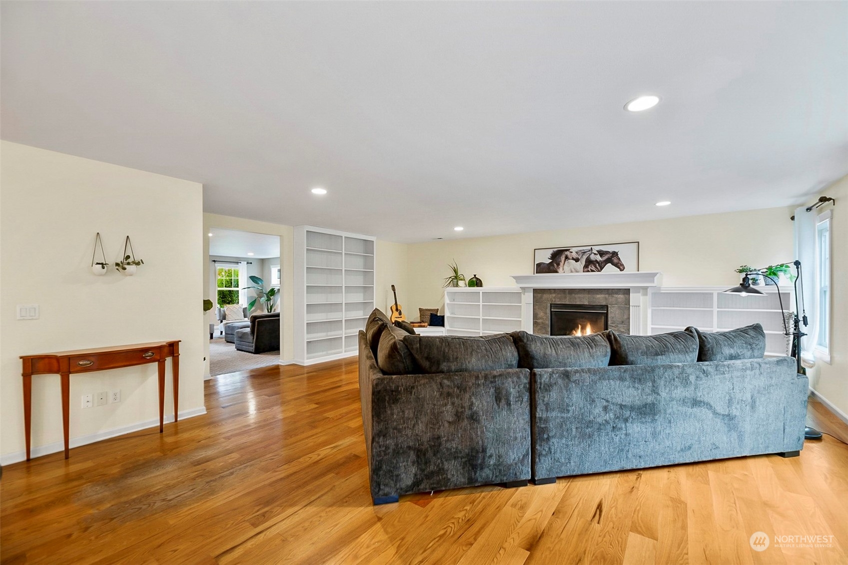 20227 Rustic View Road Southeast Monroe, WA 98272 - Photo 8 of 37 a living room with fireplace furniture and wooden floor