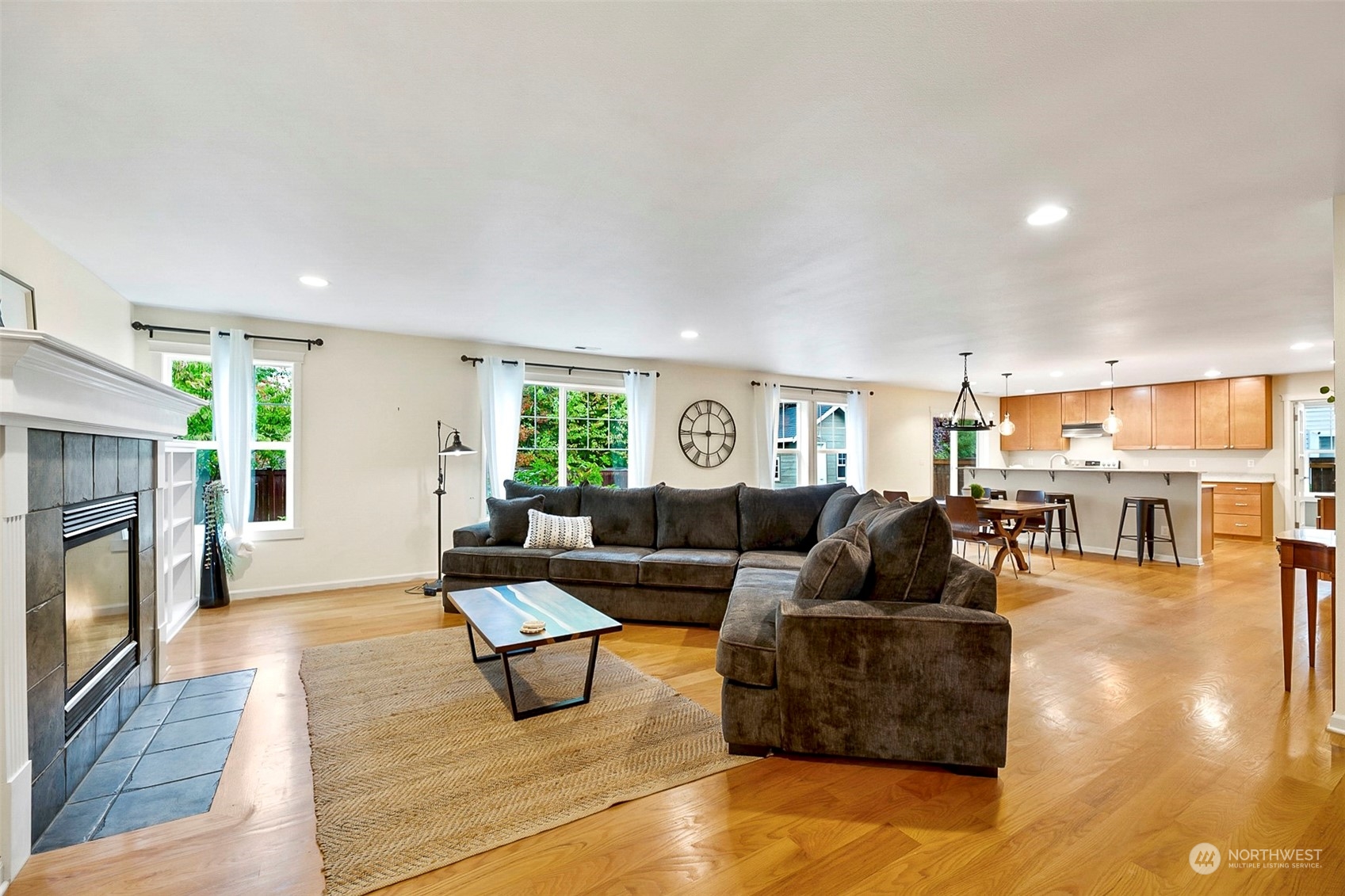 20227 Rustic View Road Southeast Monroe, WA 98272 - Photo 9 of 37 a living room with furniture and a fireplace