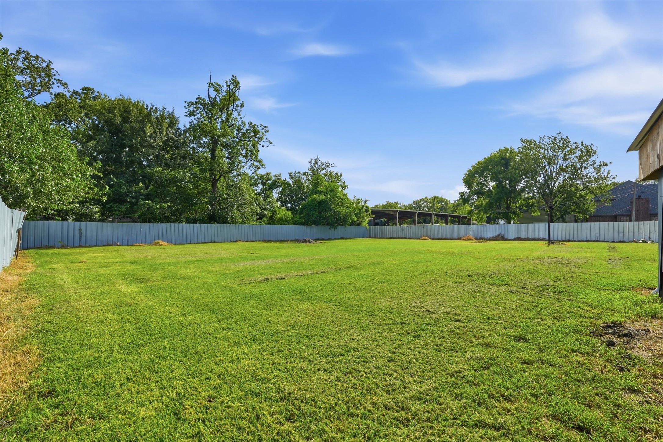 212 Jones Road Highlands, TX 77562 - Photo 21 of 24 a view of a field with an trees in the background