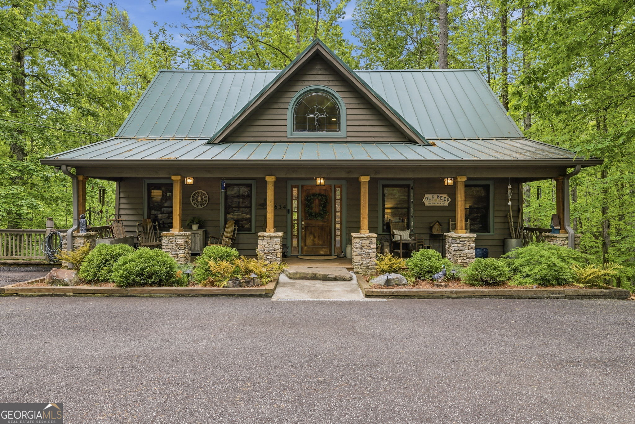 634 Little Hawk Road Sautee Nacoochee, GA 30571 - Photo 1 of 54 a front view of a house with a garden and plants