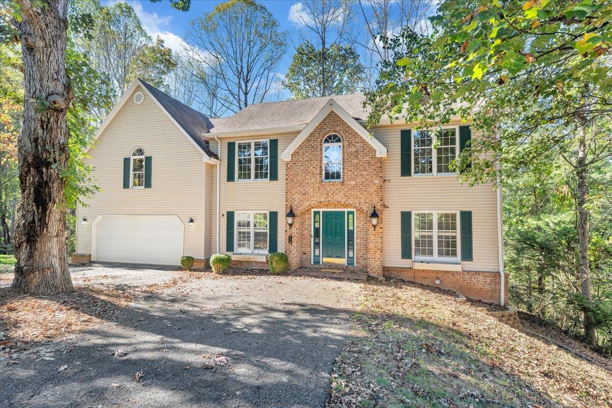 5539 Highfields Road Roanoke, VA 24018 - Photo 1 of 69 a front view of a house with a garden