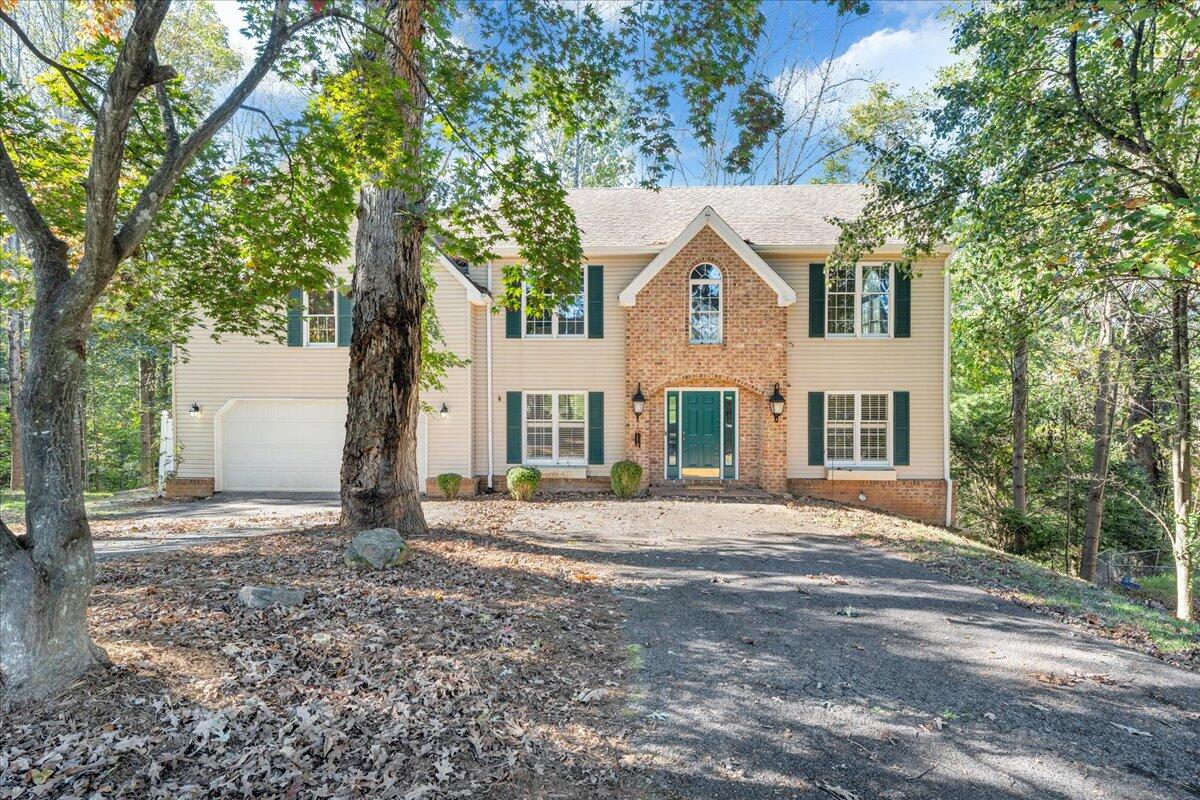 5539 Highfields Road Roanoke, VA 24018 - Photo 2 of 69 a front view of a house with a yard and garage
