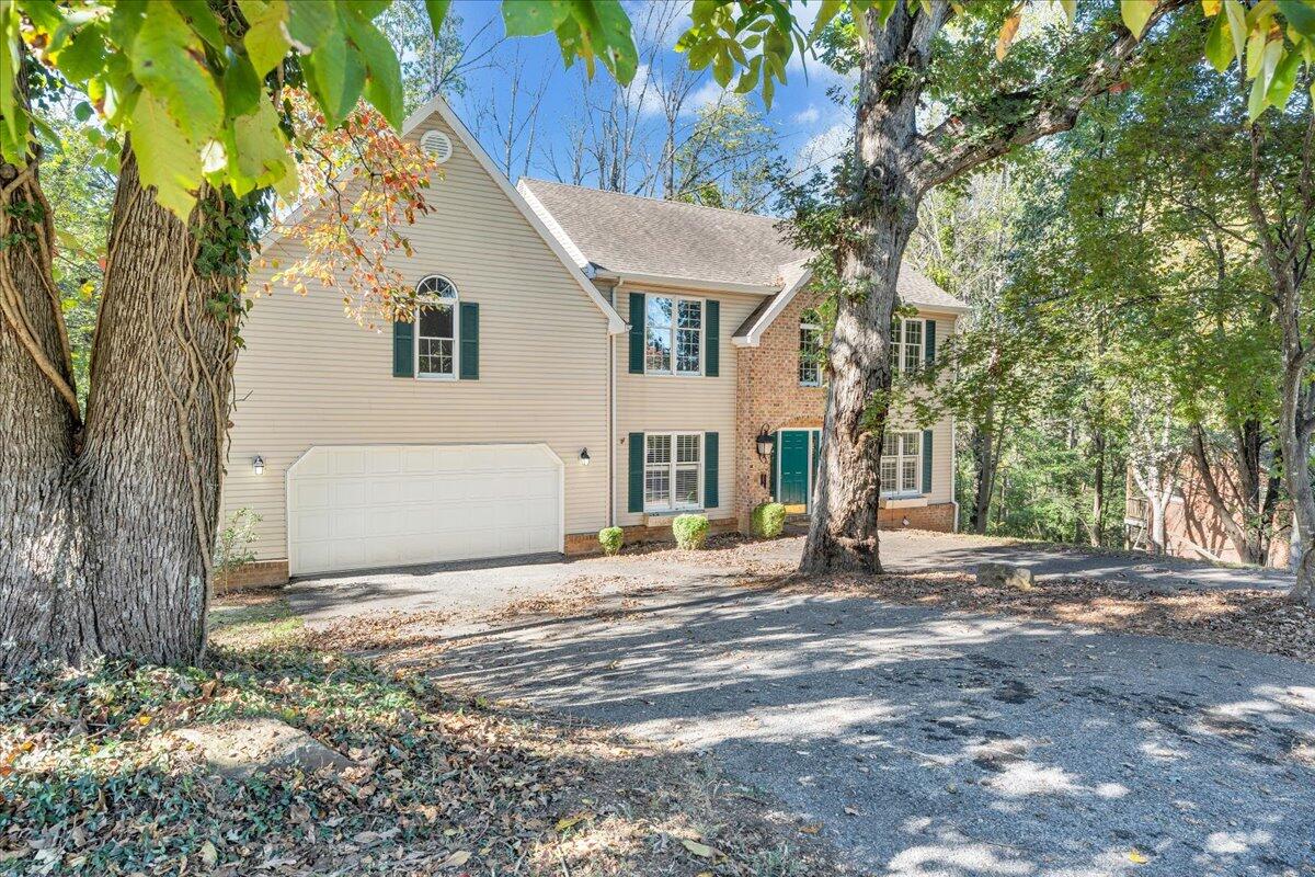 5539 Highfields Road Roanoke, VA 24018 - Photo 3 of 69 a view of a white house next to a road and yard