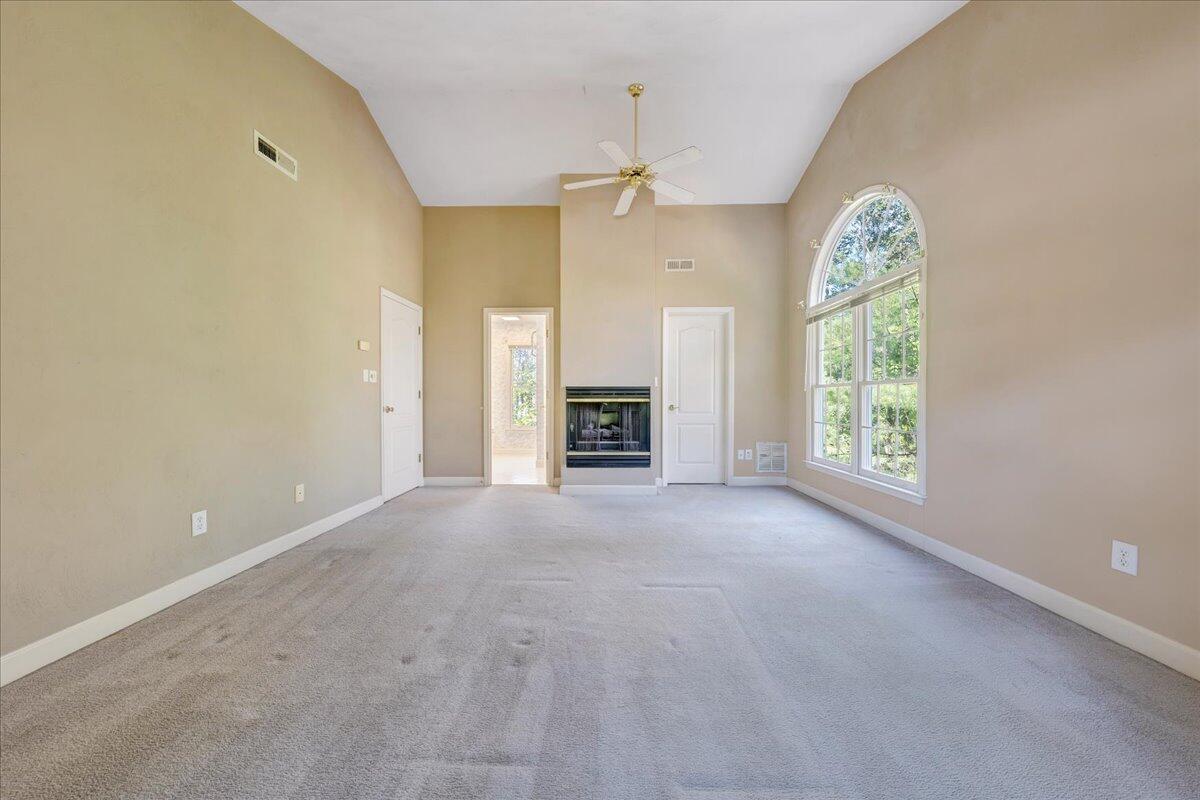 5539 Highfields Road Roanoke, VA 24018 - Photo 34 of 69 en empty room with windows and fireplace
