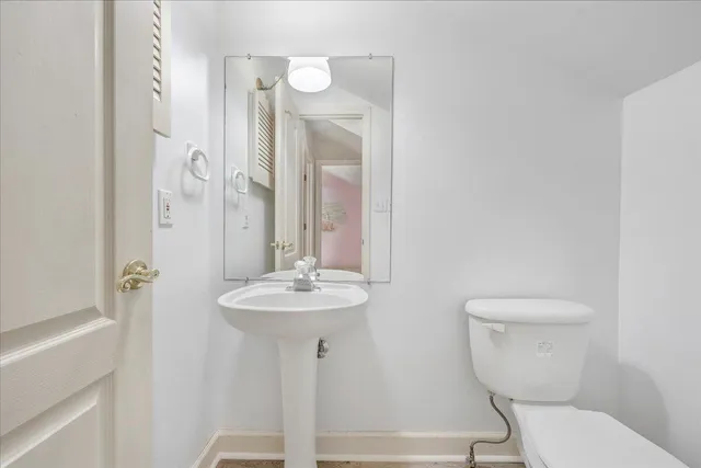 a spacious bathroom with a granite countertop sink and a mirror