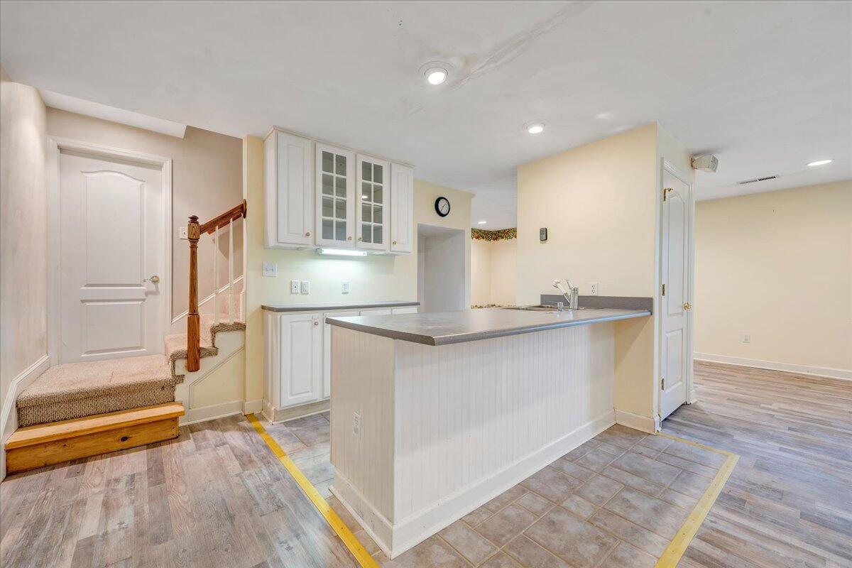 5539 Highfields Road Roanoke, VA 24018 - Photo 50 of 69 a spacious bathroom with a granite countertop sink and a mirror