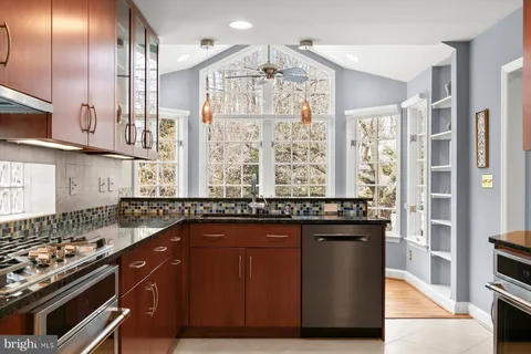 a living room with furniture and large windows