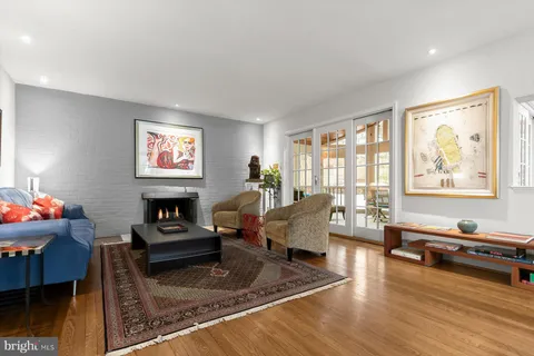 a picture of a bench in front of a building