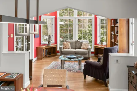 a bedroom with furniture and a flat screen tv