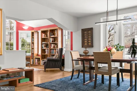 a white bath tub sitting in a bathroom next to a window
